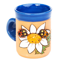 Coupe en céramique bleue avec deux coccinelles